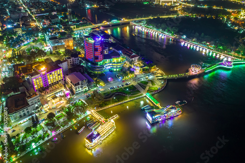 Fototapeta Naklejka Na Ścianę i Meble -  Can Tho city, Can Tho, Vietnam at night, aerial view. This is a large city in Mekong Delta, developing infrastructure, population, and agricultural product trading center of Vietnam