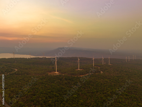 aerial view wind turbine viewpoint at Lamtakong dam,Nakhonratchasima, Thailand.
amazing sky of sunset above Lamtakong dam beautiful reflection on the large pond.
Gradient color. Sky texture,  photo