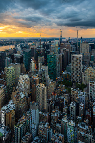 A rain storm over the midtown Manhattan in New York City during beautiful sunset. © Ondrej Bucek