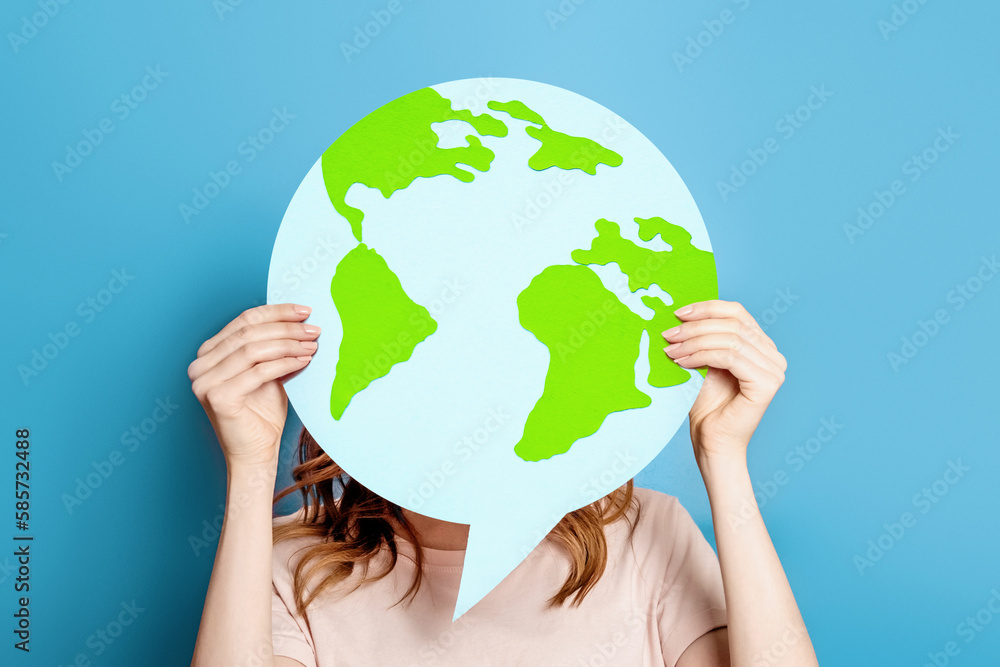 Earth day concept. Ecological problems of the globe, planet. Girl holding poster with earth paper bag Earth day concept. Ecological problems of the globe, planet. Girl holding poster with earth paper bag