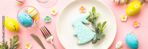 Easter food background with holiday decorations. Easter table setting. Flat lay long format.