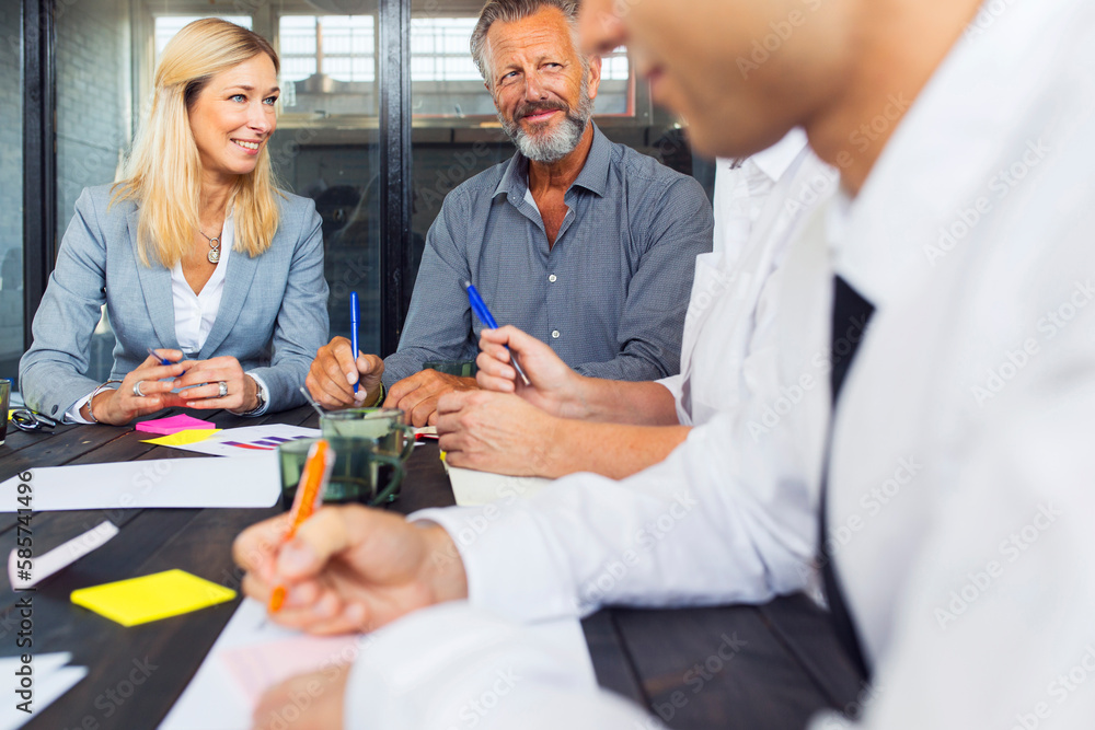 Business people discussing in office Business people discussing in office