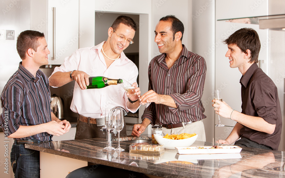 Gay Lifestyle: Prosecco Party. A group of same sex friends socialising and enjoying a glass of wine together. From a series of related images.