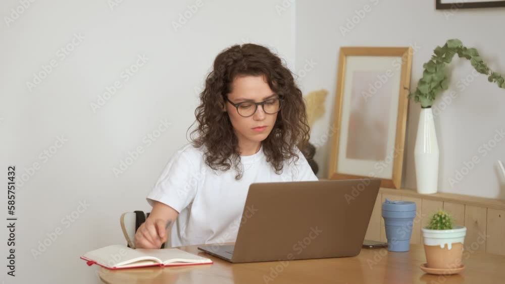 Focused young woman entrepreneur typing on laptop doing research. Female professional using computer sitting at home office desk. Busy worker freelancer working on modern tech notebook device. Focused young woman entrepreneur typing on laptop doing research. Female professional using computer sitting at home office desk. Busy worker freelancer working on modern tech notebook device.