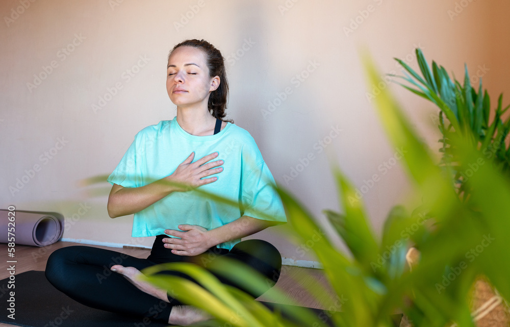 Woman doing yoga breathing exercise. Woman doing yoga breathing exercise.