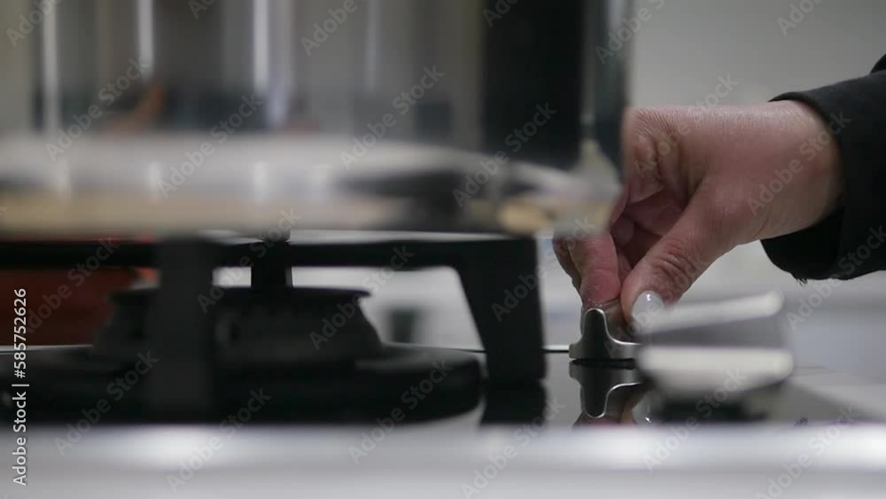 Slow motion turning on a gas stove burner as the flame ignites. Slow motion turning on a gas stove burner as the flame ignites.