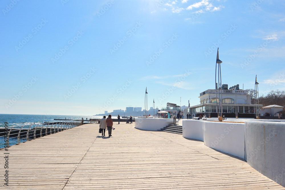  View of the embankment with a pier on a sunny day in Odessa, Ukraine