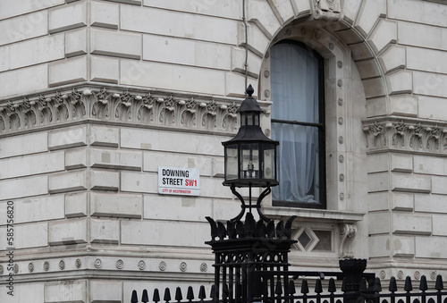 Downing Street sign on the wall of a government building in Westminster, London, UK.   photo
