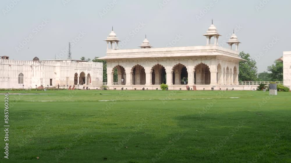 Marble pavilion Rang Mahal inside Red Fort with visitors during warm