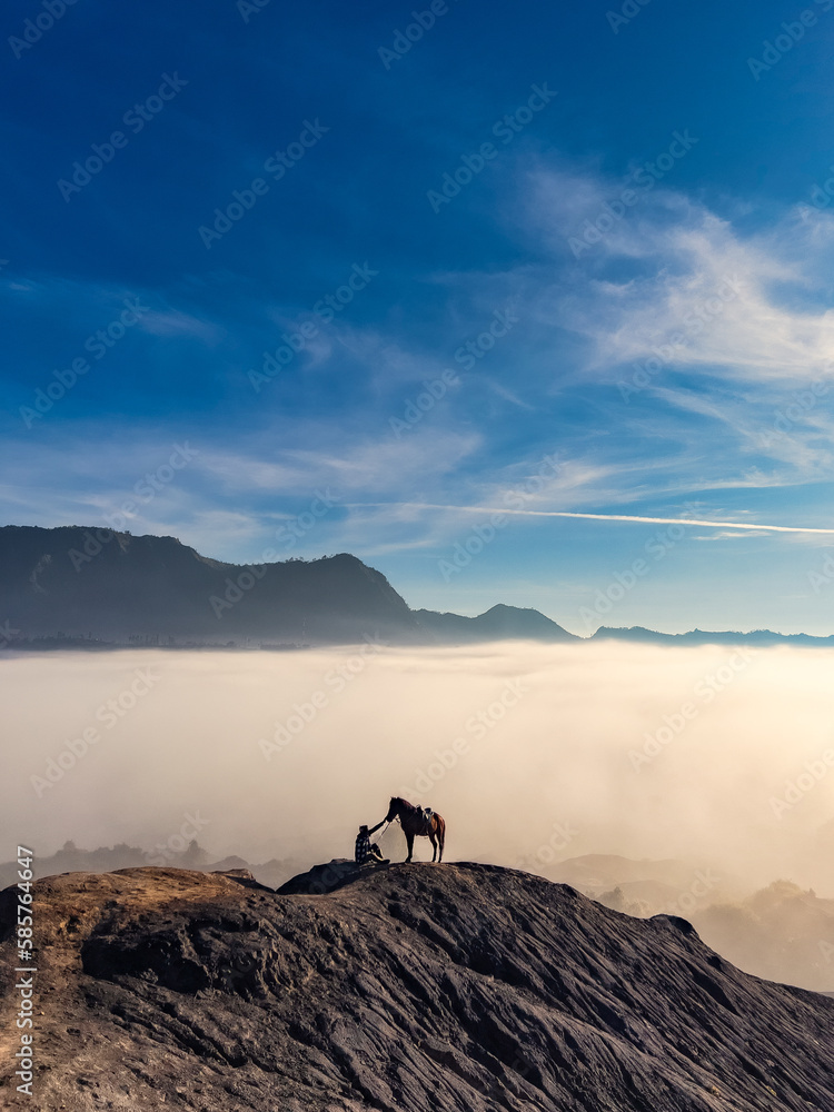 person on the top of the mountain