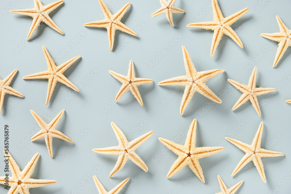 Pattern with starfishes and seashells on blue background. Top view. Concept summer beach vacation. Pattern with starfishes and seashells on blue background. Top view. Concept summer beach vacation.