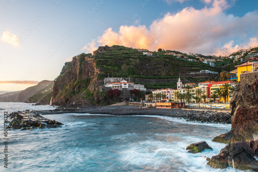 Sunset at Ponta do Sol, town at atlantic ocean with beach and cliffs in Madeira, Portugal