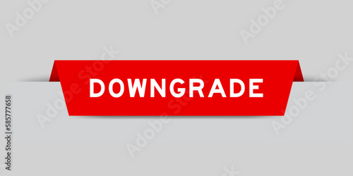 Red color inserted label with word downgrade on gray background