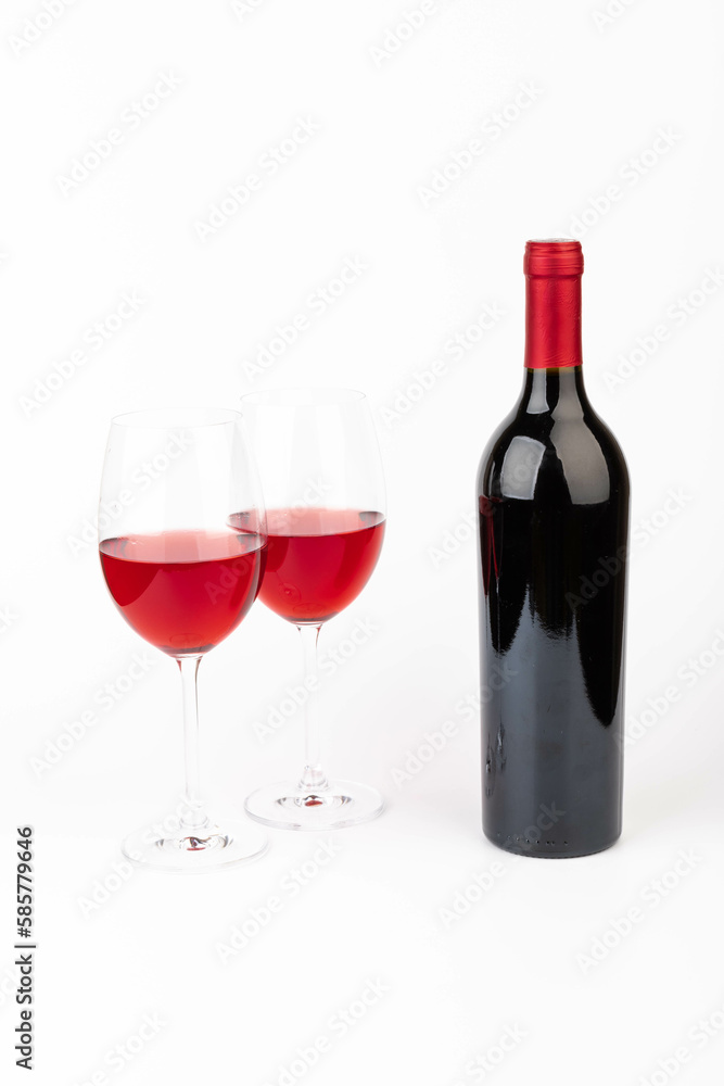 Bottle and glass with wine isolated on white