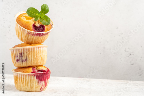 Fototapeta Naklejka Na Ścianę i Meble -  Baked Melba Raspberry Peach Muffins on a white background