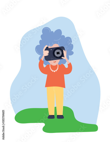 An elder woman - photographer taking pictures with camera in travelling. Aged tourist with gray hair