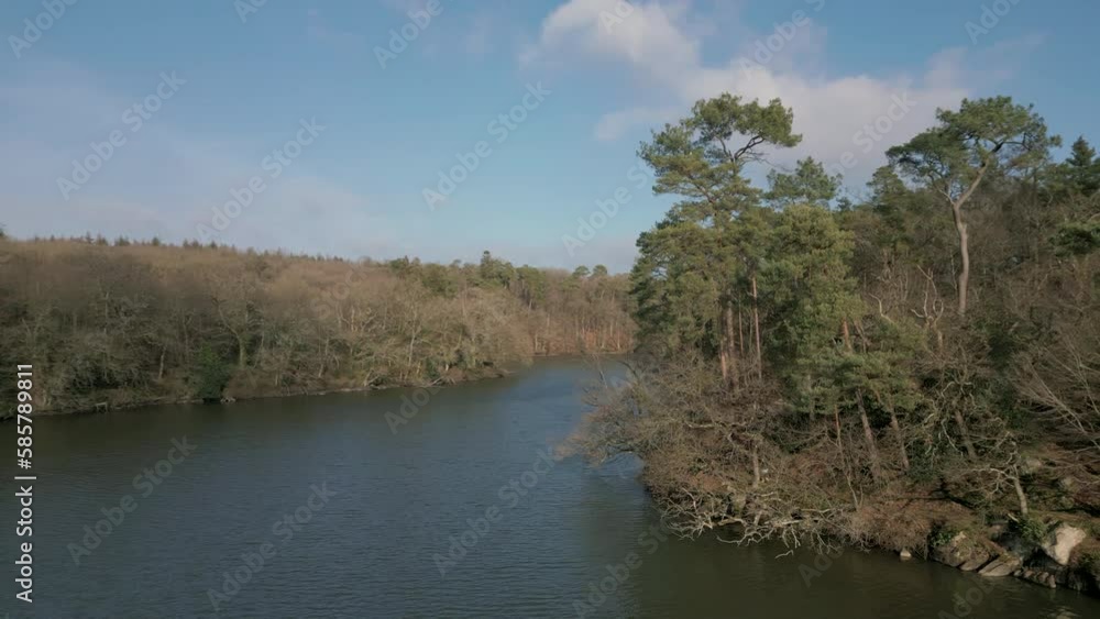 Aerial drone orbiting over Fontaine Daniel pond, Mayenne in France Aerial drone orbiting over Fontaine Daniel pond, Mayenne in France