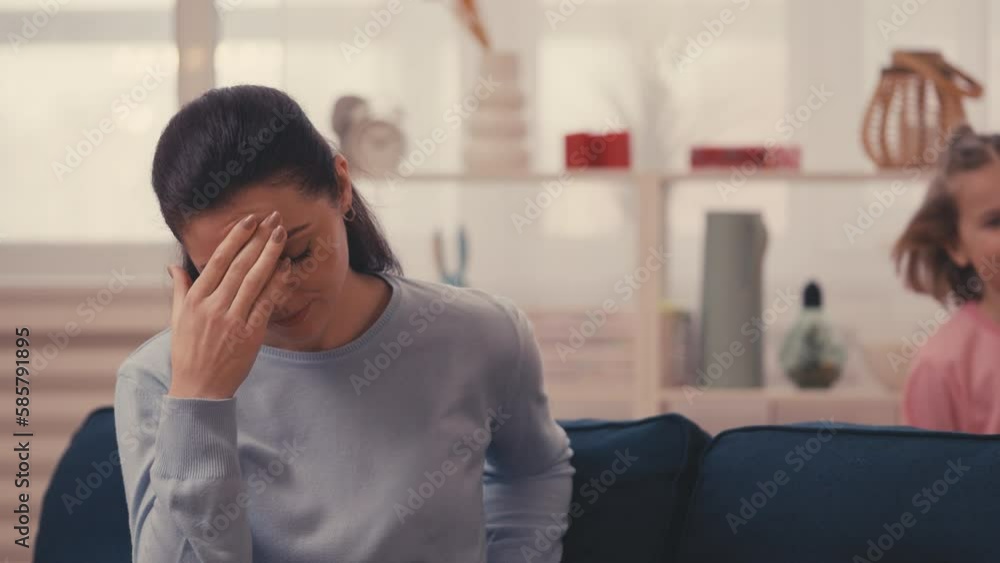 Hyperactive girl runs around, mom feels tired from the challenges of parenting Hyperactive girl runs around, mom feels tired from the challenges of parenting