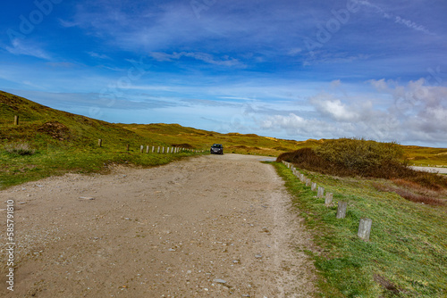 A lonely SUV in Normandy shoreline landscape