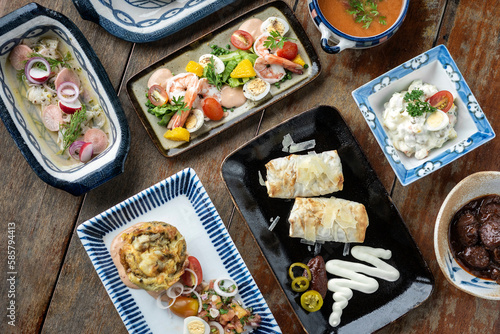 Canvas Print selection of many different tapas on rustic wood table