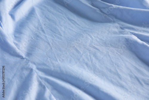 Crumpled light blue fabric as background, closeup view