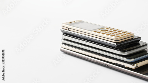 Wallpaper Mural Lots of smartphones different generations on a white background. Modern gadgets. Copy space Torontodigital.ca