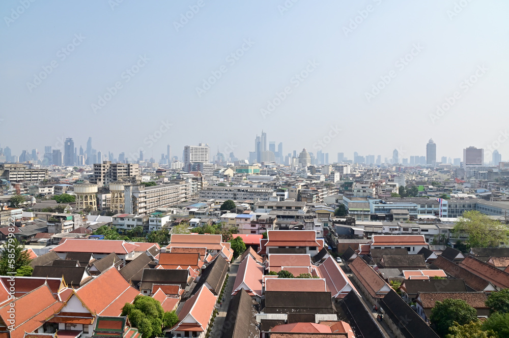 BANGKOK, THAILAND - April 12, 2023 : Landscape View of Bangkok City and Thai Buddhist Temple with Blue sky with white cloud. Clear day and good weather in the morning.