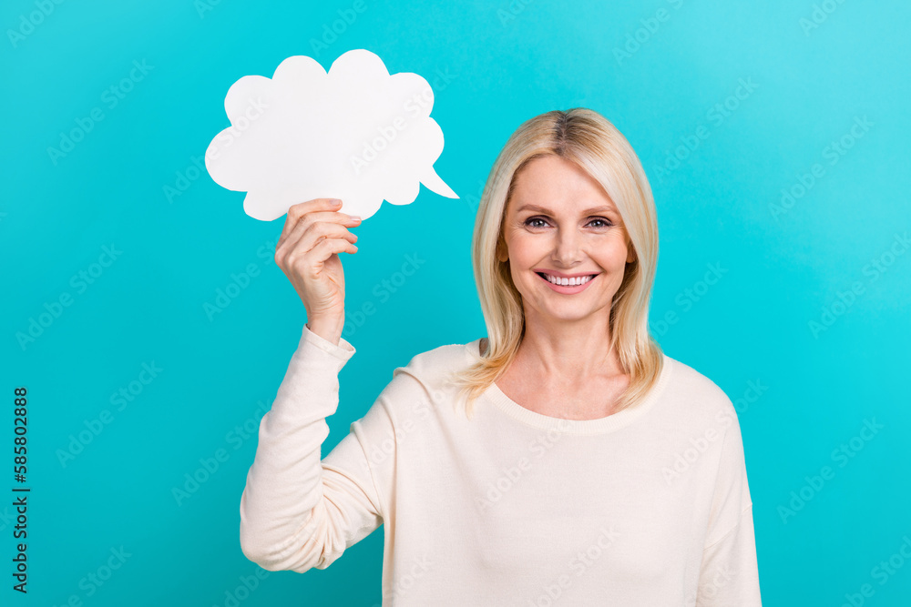 Photo of pensioner businesswoman wear white shirt hold paper bubble cloud creative idea empty space speech ad isolated on aquamarine color background Photo of pensioner businesswoman wear white shirt hold paper bubble cloud creative idea empty space speech ad isolated on aquamarine color background
