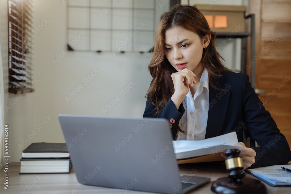 Lawyer working at office with documents on his desk, financial adviser analyzing data.