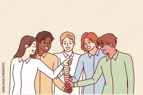 Happy diverse business team of employees celebrating success by touching with fists in center and enjoying working together. Positive people cooperate together to achieve best results and meet KPIs 