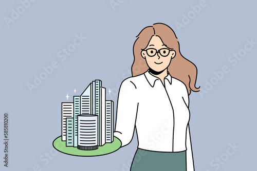 Smiling businesswoman hold building model on hand work in real estate. Happy confident broker or agent recommend property loan or mortgage. Realty and rent. Vector illustration. 
