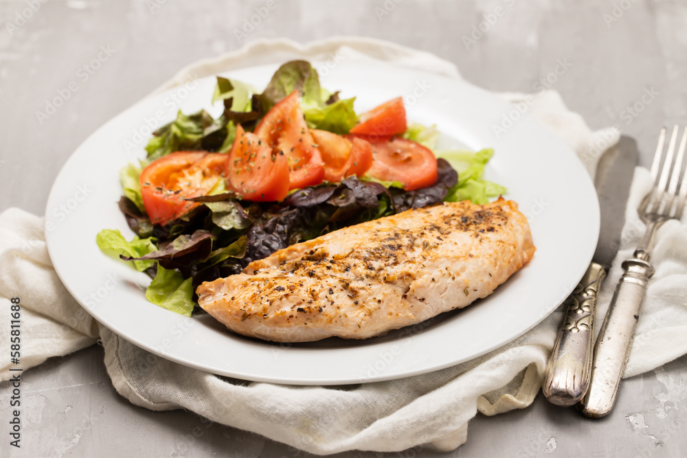 Baked turkey with vegetable fresh salad on plate Baked turkey with vegetable fresh salad on plate