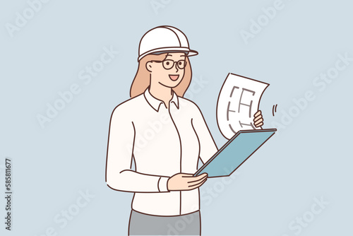 Female engineer with blueprint at site 