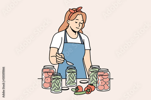 Woman in apron canning vegetables in bottles in kitchen. Housewife conserve veggies at home. Household and nutrition. Vector illustration. 