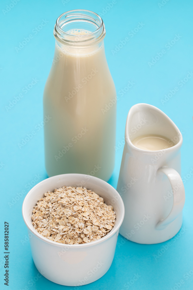 Oat milk. Healthy vegan non-dairy organic drink with flakes Oat milk. Healthy vegan non-dairy organic drink with flakes