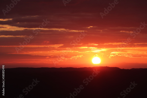 red sun comes down landscape © Solene
