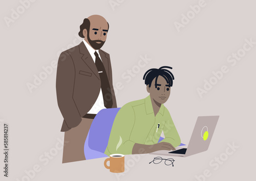 A senior manager supervising an intern in the office