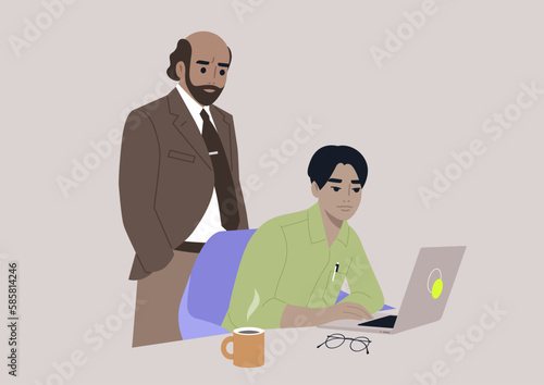 A senior manager supervising an intern in the office