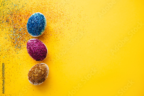 Photography Happy easter! Creative preparing for Easter by decorating eggs with colorful glitter