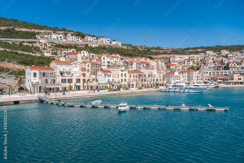 Lustica bay in Montenegro on the Adriatic coast, view of the city and the marina with yachts. Popular summer holiday destinations in Europe