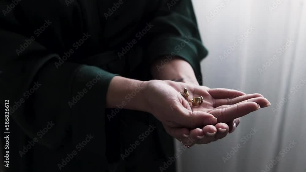Slow motion shot of a ring bearer holding both rings to provide during the wedding Slow motion shot of a ring bearer holding both rings to provide during the wedding