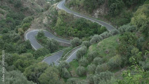 Shot of winding road leading to Savoca at sunset, Savoca, Sicily, Italy, Mediterranean, Europe photo