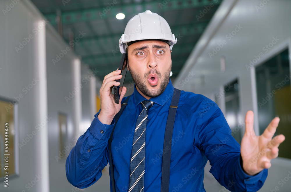 angry businessman manager in suit shouting with serious stress and aggressive bad problem in factory warehouse office with team by mobile phone angry businessman manager in suit shouting with serious stress and aggressive bad problem in factory warehouse office with team by mobile phone