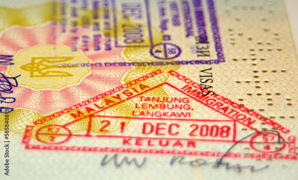 Page of passport with Malaysian customs stamps