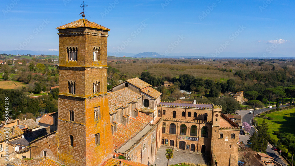 Obraz premium Aerial view of the cathedral Santa Maria Assunta in the historic center of Sutri, town located near Viterbo and Rome, Italy. The Romanesque church with its bell tower dominates the city.