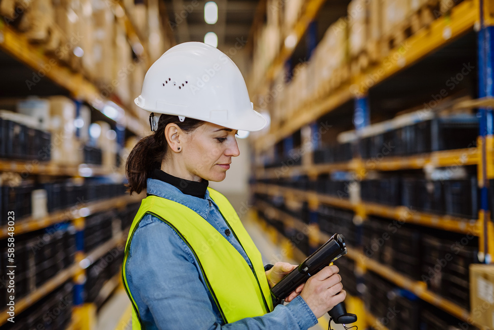 Warehouse female worker checking up stuff in a warehouse. Warehouse female worker checking up stuff in a warehouse.