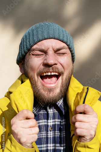 Candid positive emotions of adult bearded man. photo