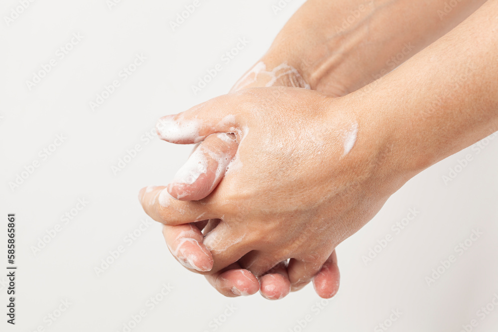 Fototapeta premium Washing men's hands with soap. Personal hygiene concept, hand washing.