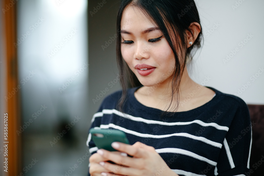 Young Smiling Woman Using Mobile Phone At Home. Pretty Woman Making Selfie. Young Smiling Woman Using Mobile Phone At Home. Pretty Woman Making Selfie.