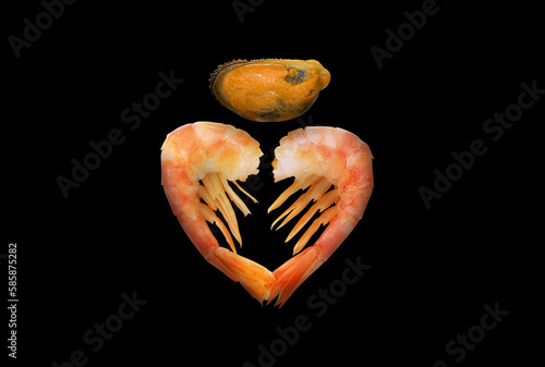Shrimps and mussel as a creative set of seafood theme on black.